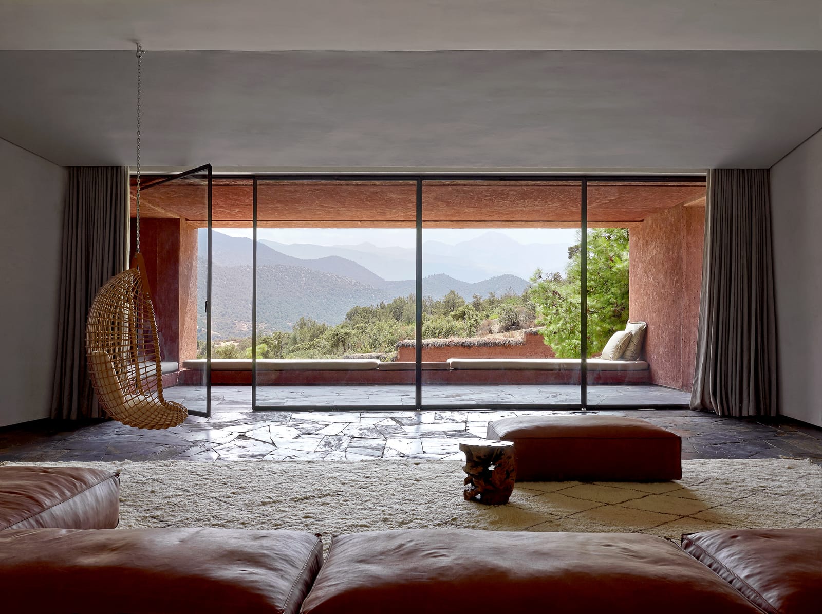 The main living room opening onto the terrace and valley, Villa E