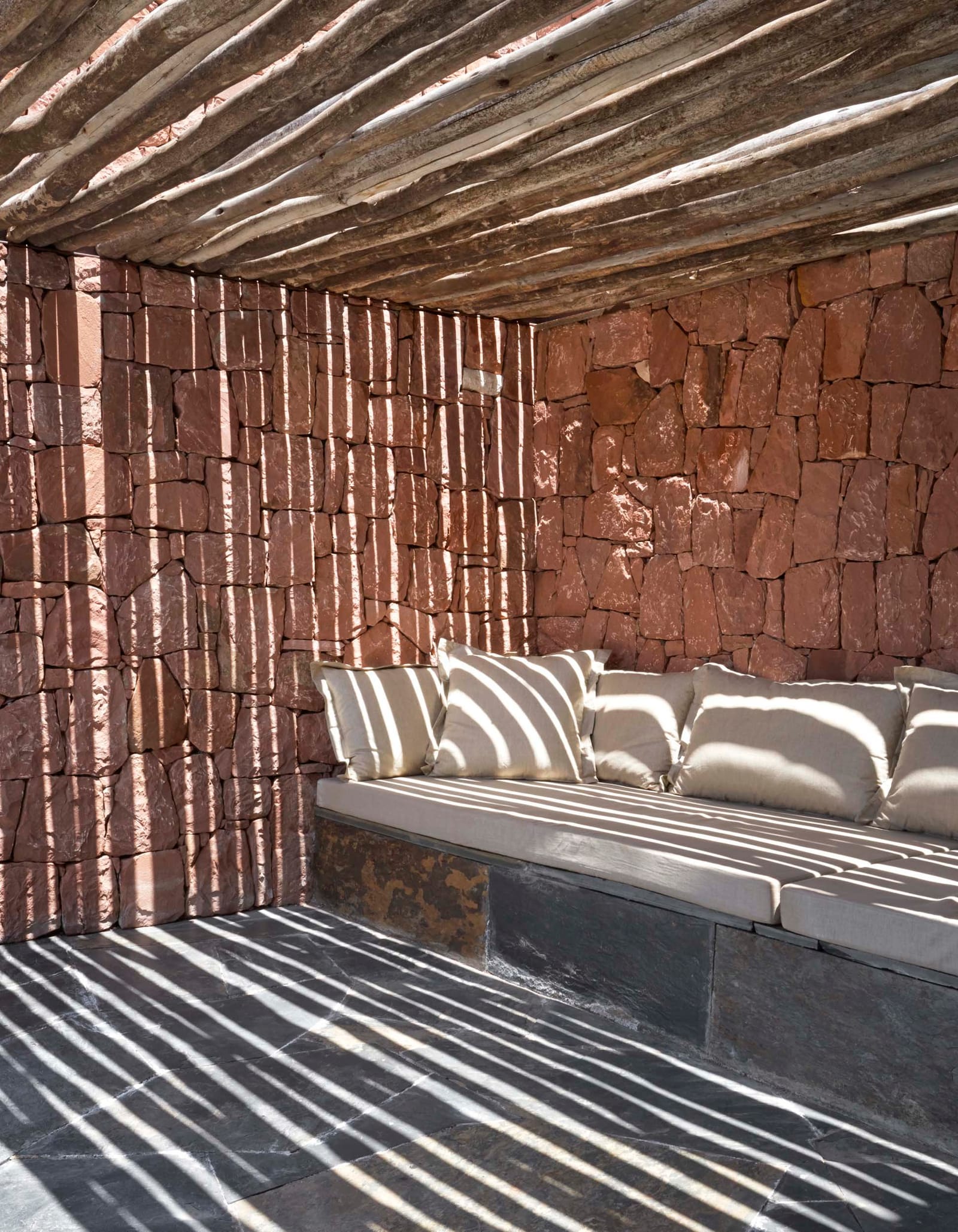 Banquette under the branch pergola with striped shade, Villa E